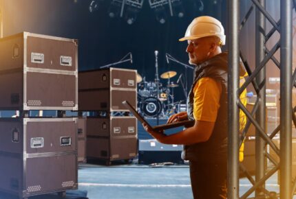 a male employee working on a rigging system