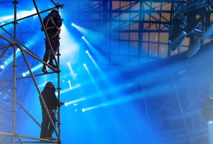 stage workers wearing protective gear